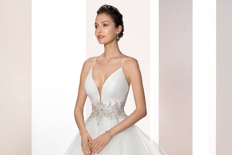 Style 726 <br>	Crystals, bugle beads and pearls create a magnificent bodice on this strapless Tulle gown with a Sweetheart bodice, dropped waist and Chapel train.