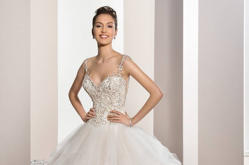 Style 722 <br>	This elegant Ball gown features a richly embellished beaded bodice with soft Sweetheart neckline and stunning Tulle skirt with Sweep train.