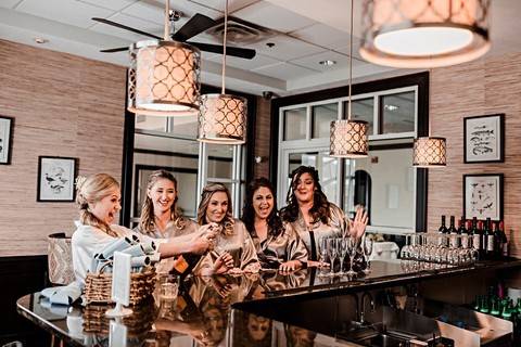 Bride and bridesmaids in dressing room