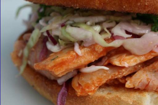 Organic Smoked BBQ Chicken Sandwich topped w/ fresh coleslaw.