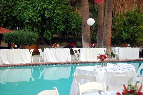 Wedding at The Lucy House in Palm Springs for 120 guests in from Boston.  Guests dined poolside as candles dotted the surface of the water.