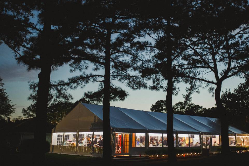 An illuminated wedding tent at night (valerie demo photography)