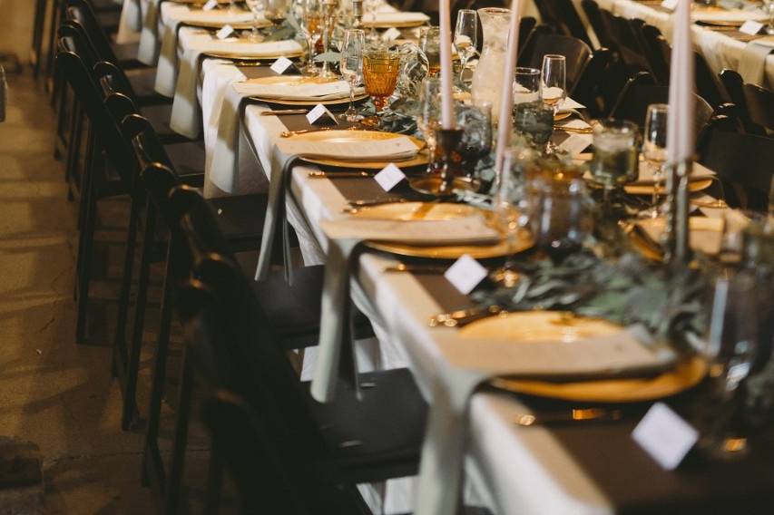 Long table setting with candle centerpiece