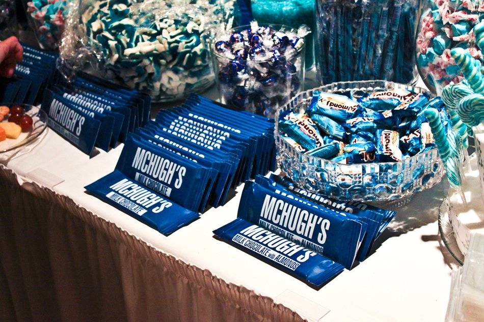 The candy buffet we designed for Beth & Brian included towers of shimmer gum balls, custom-wrapped chocolate bars, blue-striped marshmallows, gummy sharks and taffy.