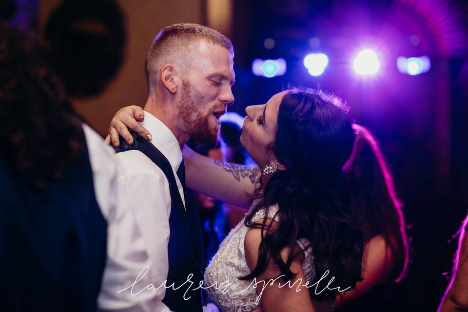 Newlyweds about to kiss on the dance floor