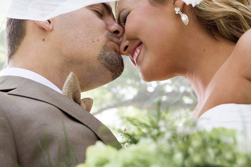 Sweet kisses from the groom