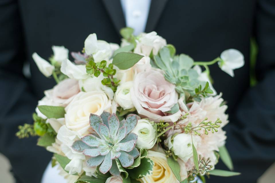 Groom holding the bouquet