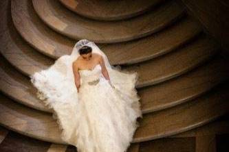 A bride walking down the stairs at San Francisco City Hall