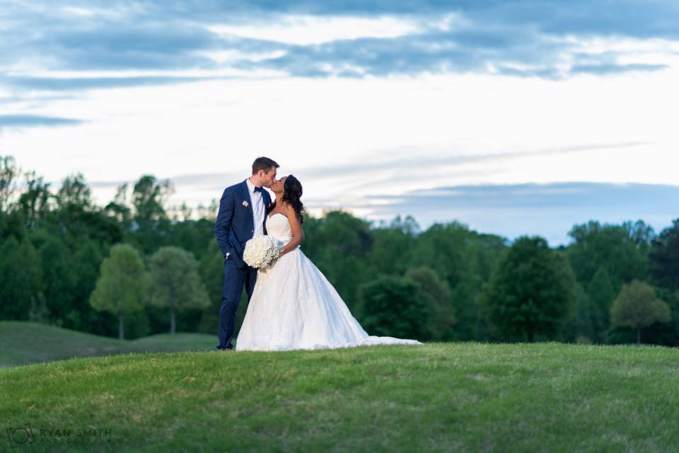 Kiss on a golf course hill