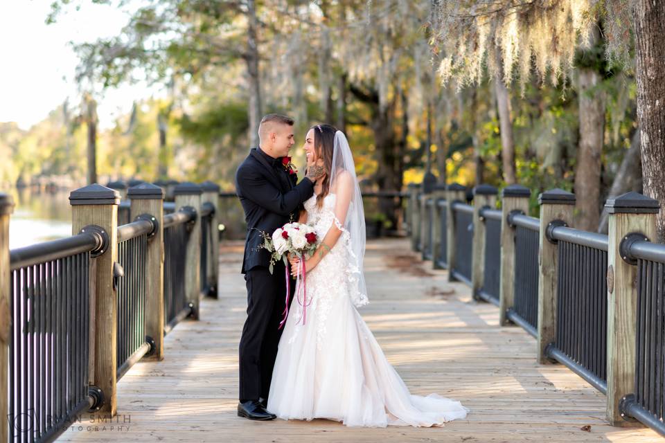 Bride and groom under the moss