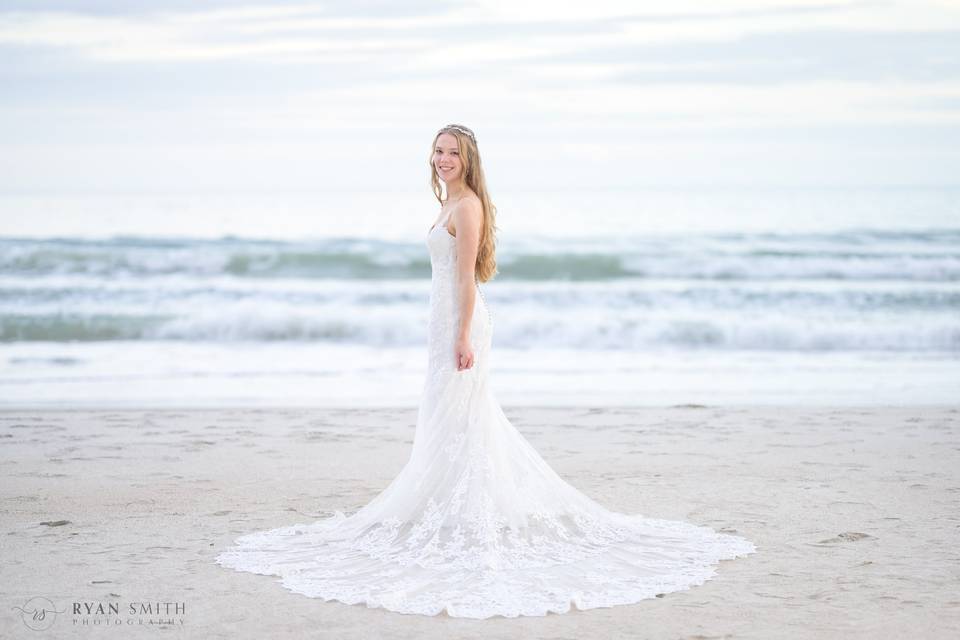 Bride standing in front ocean