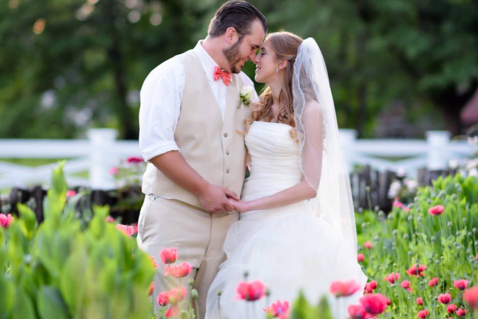 Couple standing in the flowers