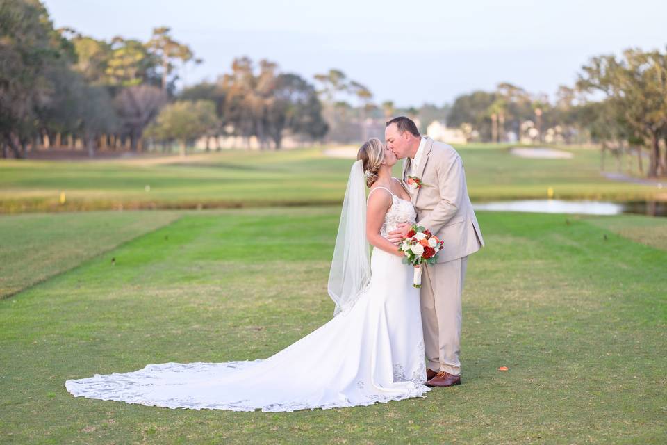 Daughter putting on mom's veil