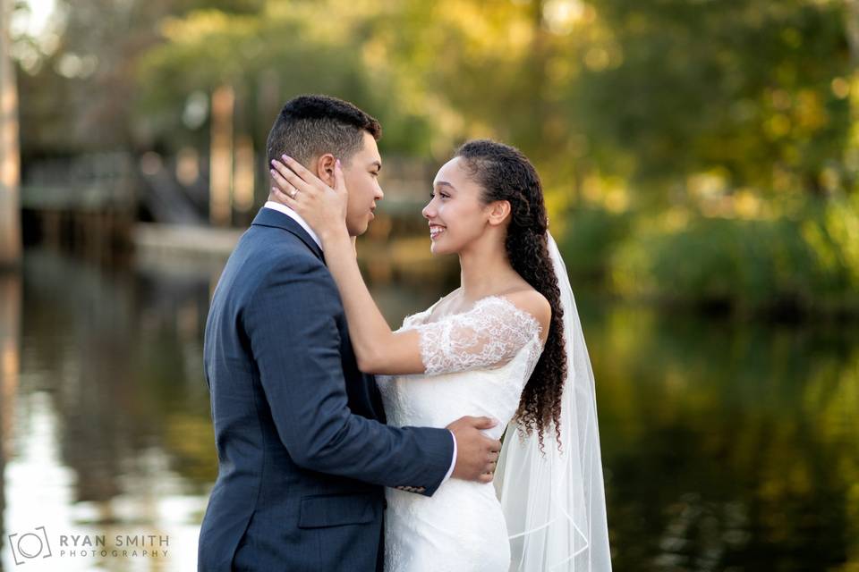 Happy couple on the river dock