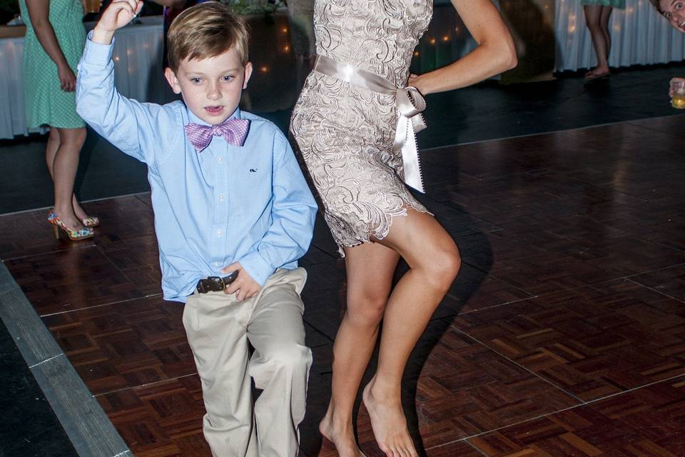 Bridesmaid and ring bearer dancing