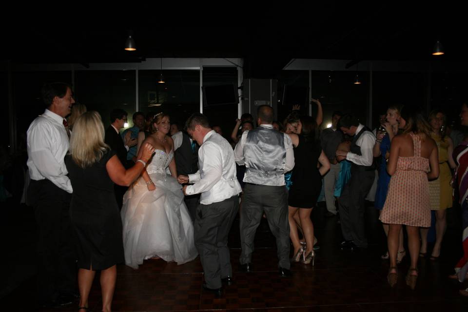 Couple dancing with guests