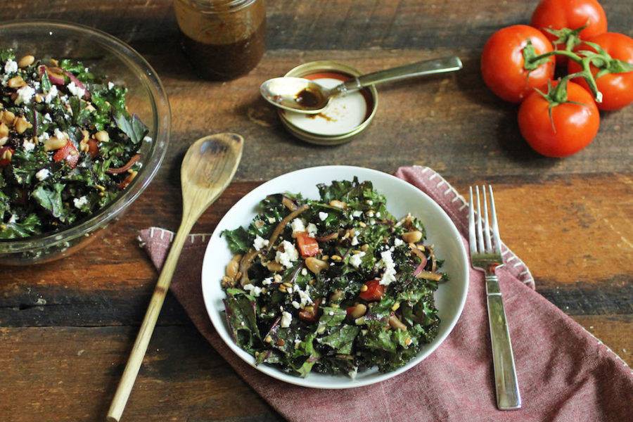 Fall inspired kale salad with goat cheese, apples, candied pecans, balsamic dressing