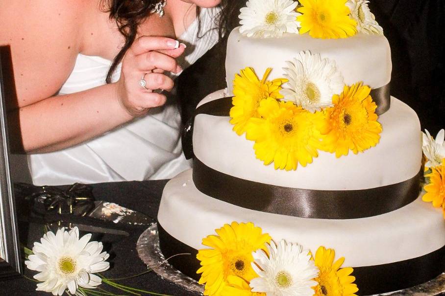 Couple's photo with their wedding cake