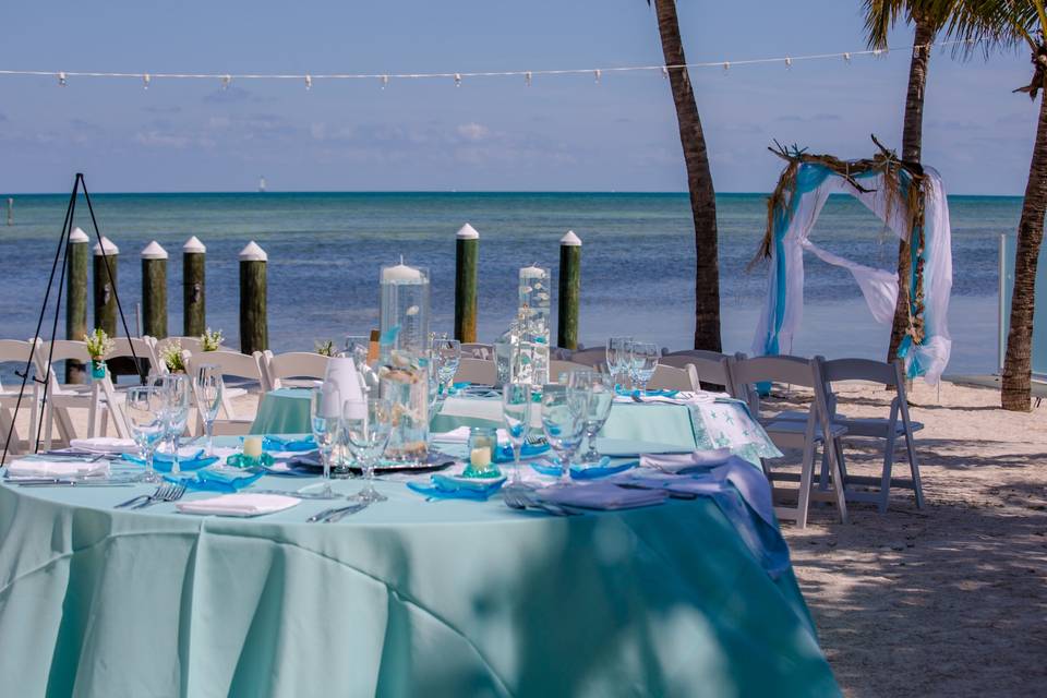 Beach wedding guest table with centerpiece