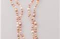Real freshwater pearls in soft pinks with hints of grey and white add elegance and class to any dress.  54