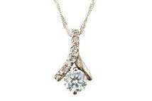 This elegant sterling silver necklace is ideal for complimenting a sweetheart or scoop neck gown. 16 1/2