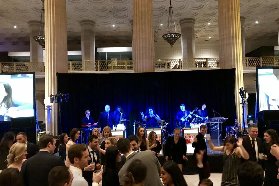 Band playing music for the reception | Venue: Wintrust Bank Building, Chicago