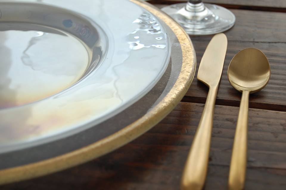 Velo brushed gold flatware, gold rimmed glass charger, luster plates