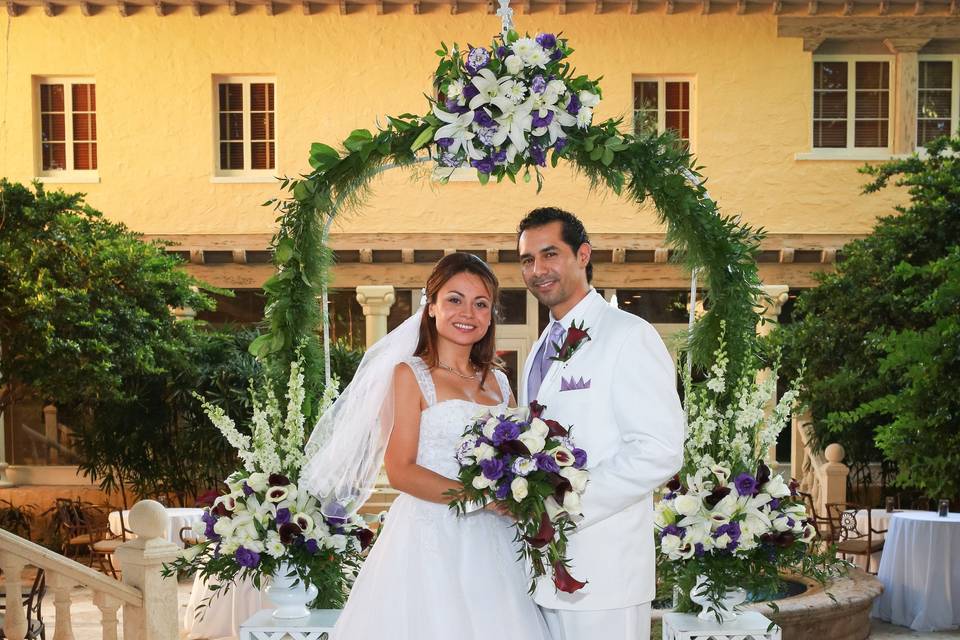 Addison Banquet Courtyard, Boca Raton. Our arch & pedestals  with fresh flowers.