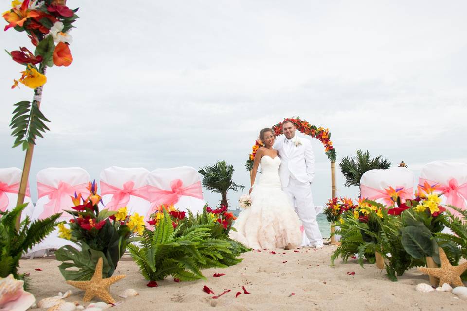 Tropical aisle with seashells, tiki torches & arch set up at Vista Park Beach Ft.Lauderdale