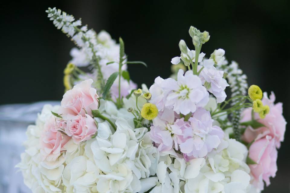 Centerpieces of Hydrangea, Spray Roses, Stock, Button Yarrow, and Veronica