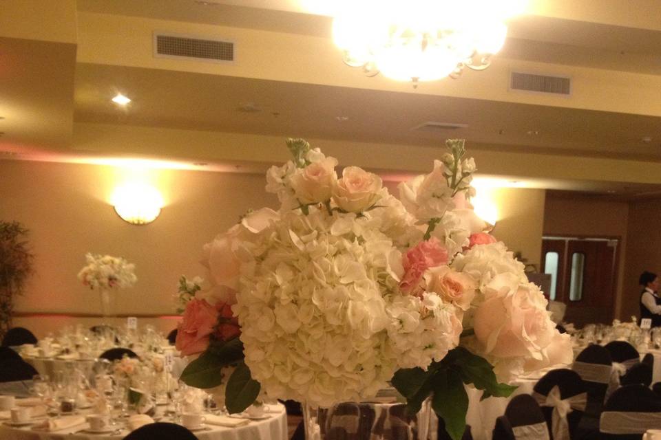 Elevated Centerpiece of Hydrangea, Stock, Roses, and Spray Roses