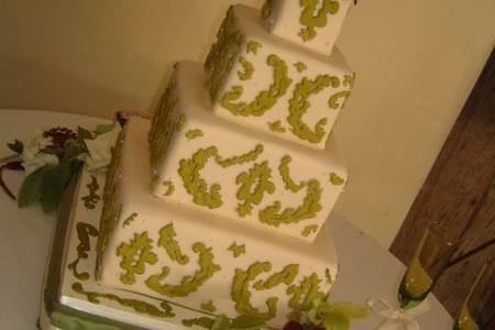 Ivory fondant with royal icing details and fresh flowers. Inspired from a martha stewart weddings design.