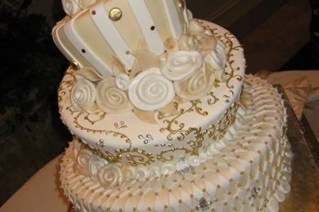 Fondant covered cake with edible gold detail, sugar roses and non edible crystals. Done for an event at the four seasons beverly hills.