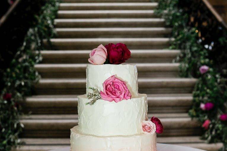 3-tier wedding cake by the stairs