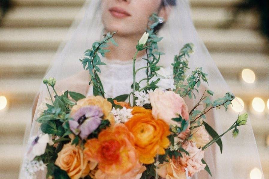 Bride in veil and her bouquet