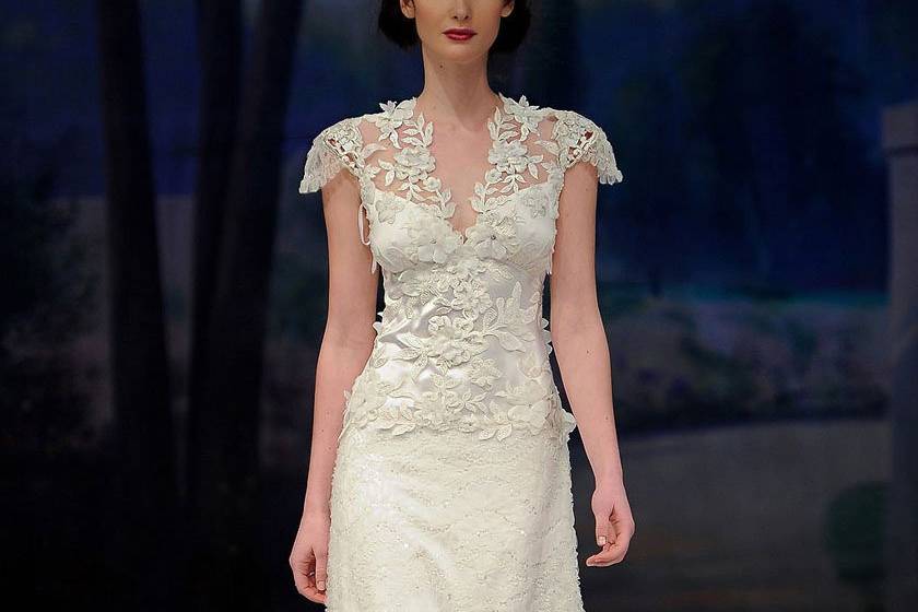 BELLE <br>Ivory short sleeve jeweled flower vine bodice with tulle ribbon skirt trimmed with silver guipure and blue silk ribbon.