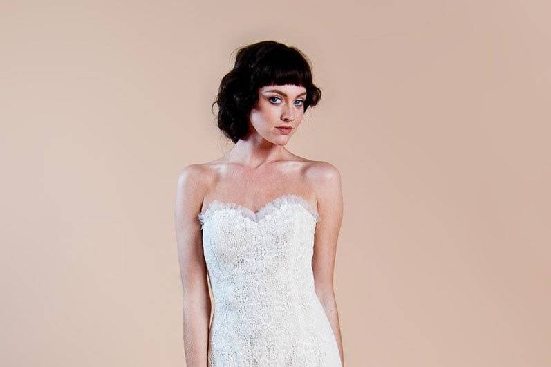 WAVERLY <br>Delicately embroidered ivory cotton tulle wedding dress with blue trimming details accented with a vintage Jacquard waistband