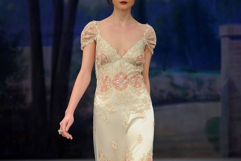 FLORA <br>Gold vines and ivory flowers scattered over tulle and silk with an open back.