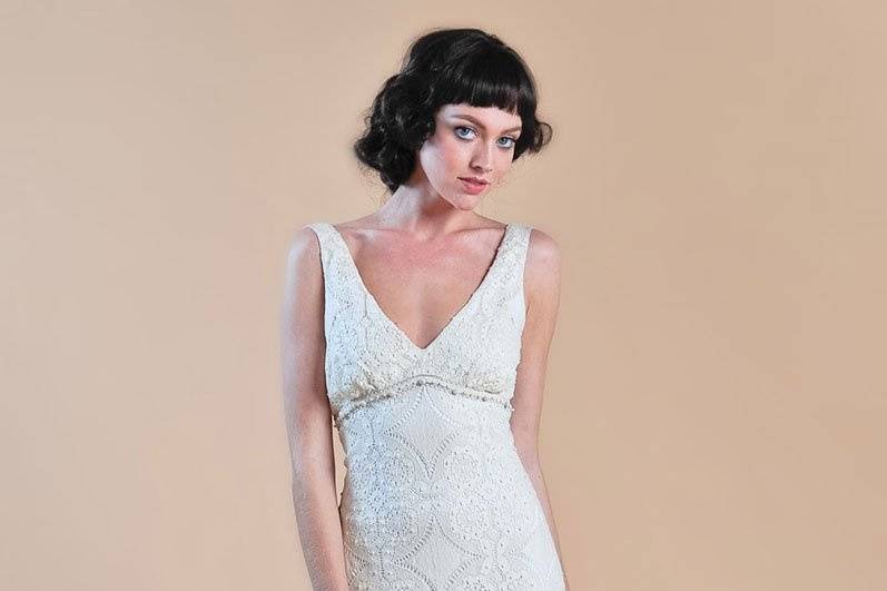 LYDIA <br>Draped cotton sheath with bubble hem, English lace accents and cascading bustle.