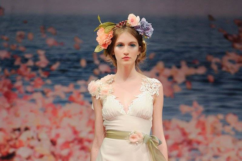 MAIDEN <br>Ivory linen with guipure leaves and jeweled blossom shoulder with green ribbon waist sash. Also available with Ivory jewels, flowers and sash.