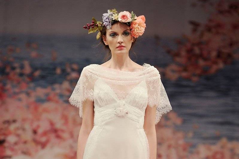 SONNET <br>Ivory linen with iridescent lace streamers and jeweled floral embellishments. Detachable capelet included.