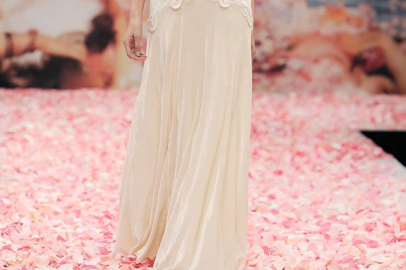 SONNET <br>Ivory linen with iridescent lace streamers and jeweled floral embellishments. Detachable capelet included.