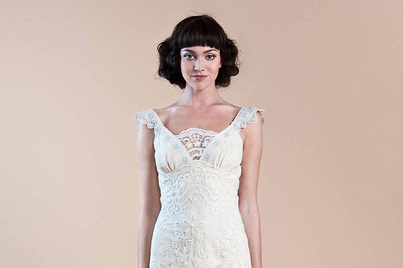 VIOLA <br>Richly embroidered tulle mermaid style wedding dress with illusion back and hand-placed guipure lace trims over luxurious platinum silk.