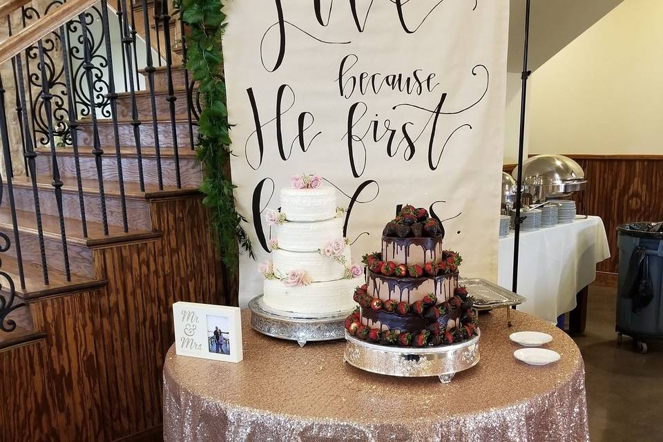 Brides cake is a White chocolate cake with strawberry filling with buttercream icing. Grooms Cake is a Chocolate Ganache with raspberry filling with chocolate mousse icing with chocolate covered strawberries