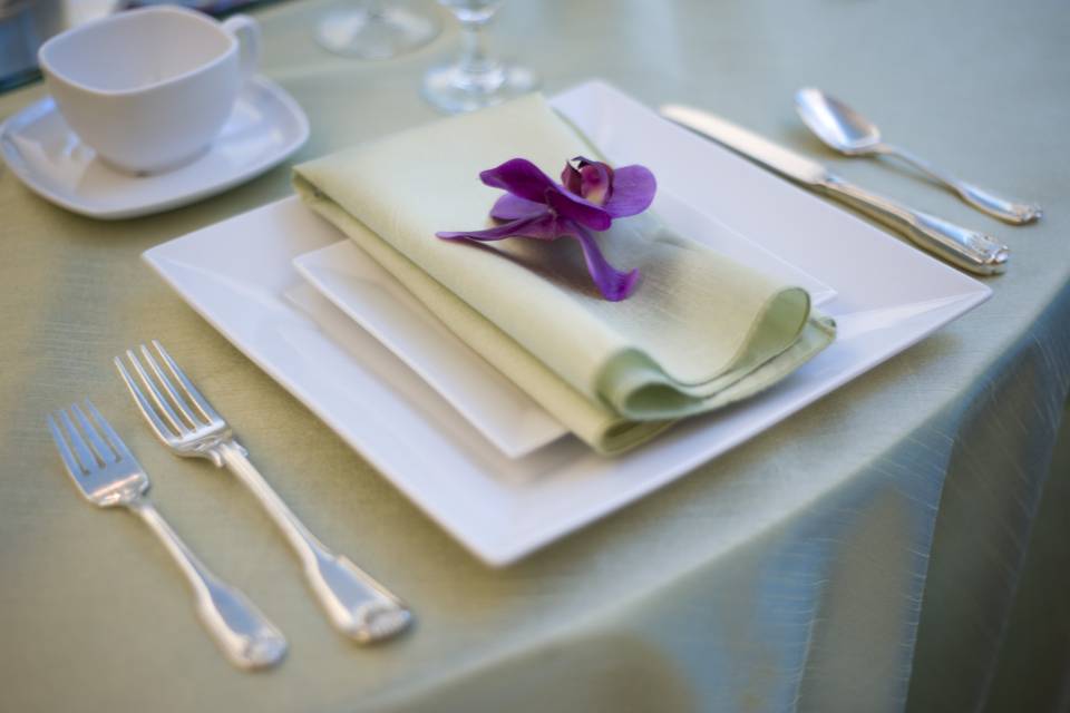 Green table napkin with flower