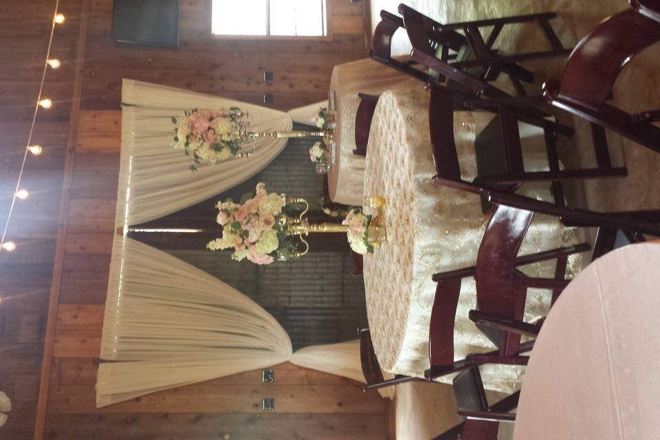 String lights, soft fabric draped entrance and candles on every table. Romantic