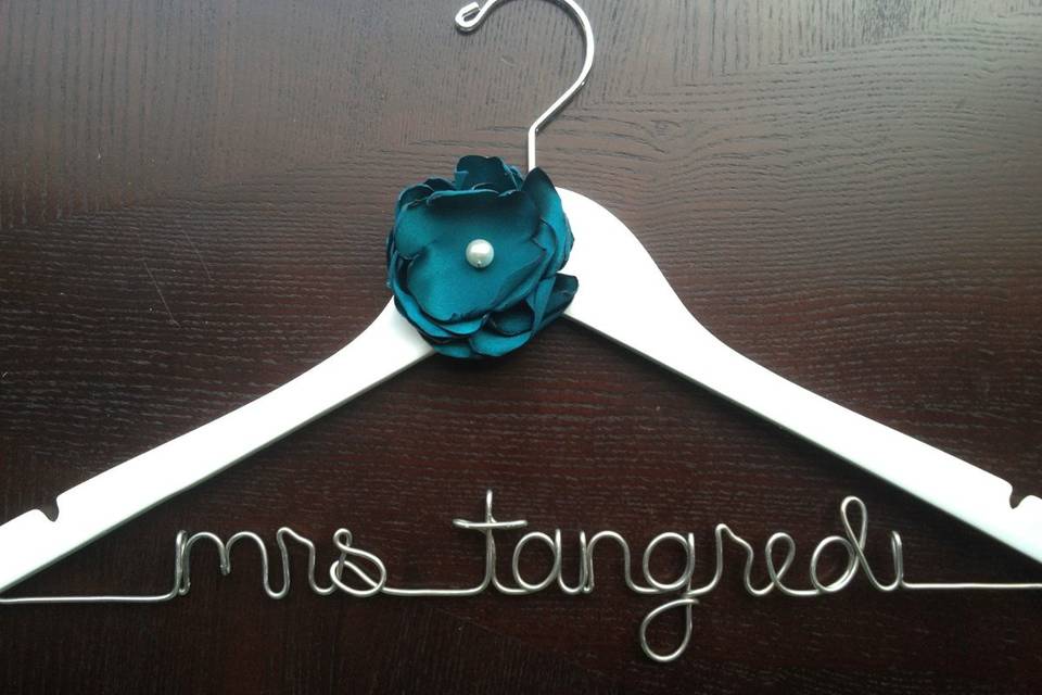 Custom hanger featuring future last name of the bride