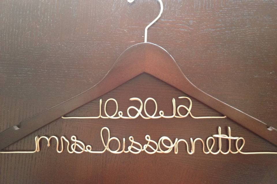 Bridal hanger featuring wedding date and bride's future last name