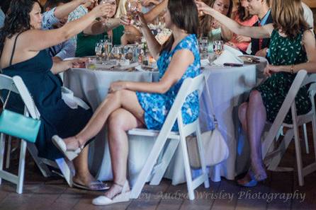 The walls of the weathered barn at Rocklands Farm are a great backdrop for a toast to the newlyweds. (Courtesy Audra Wrisley Photography)