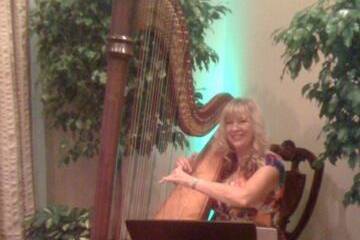 Harpist Victoria Lynn Schultz performing for an event at Walt Disney World's Grand Floridian Resort